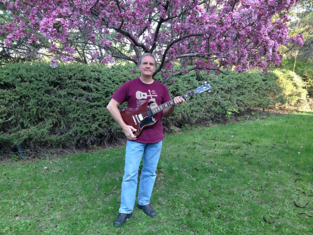 Holding my 1966 Gibson SG in April 2016 after finding it for sale on Ebay after a 14-year search. It was stolen in January 2002.